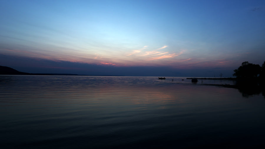 Serene Lake at Twilight with Colorful Sky Reflection