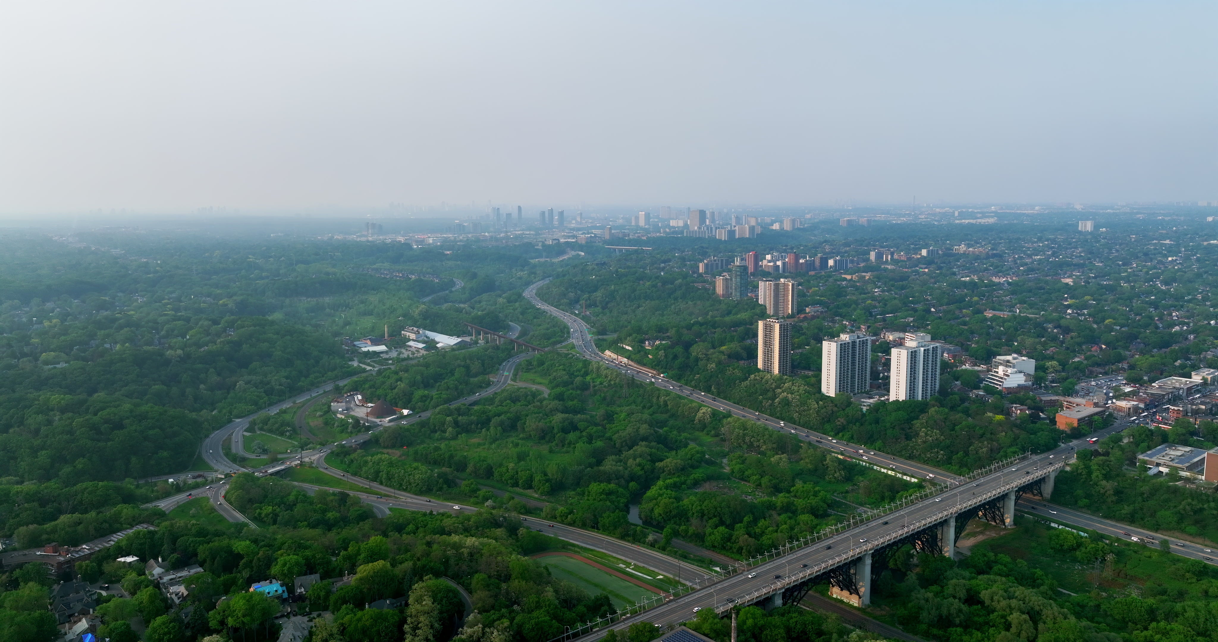 Highway Bridge Over Green Valley - Aerial — 4K stock footage