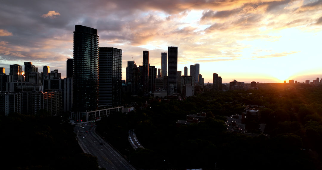 Aerial City Skyline Silhouette at Dramatic Golden Sunset — Premium 4K stock footage