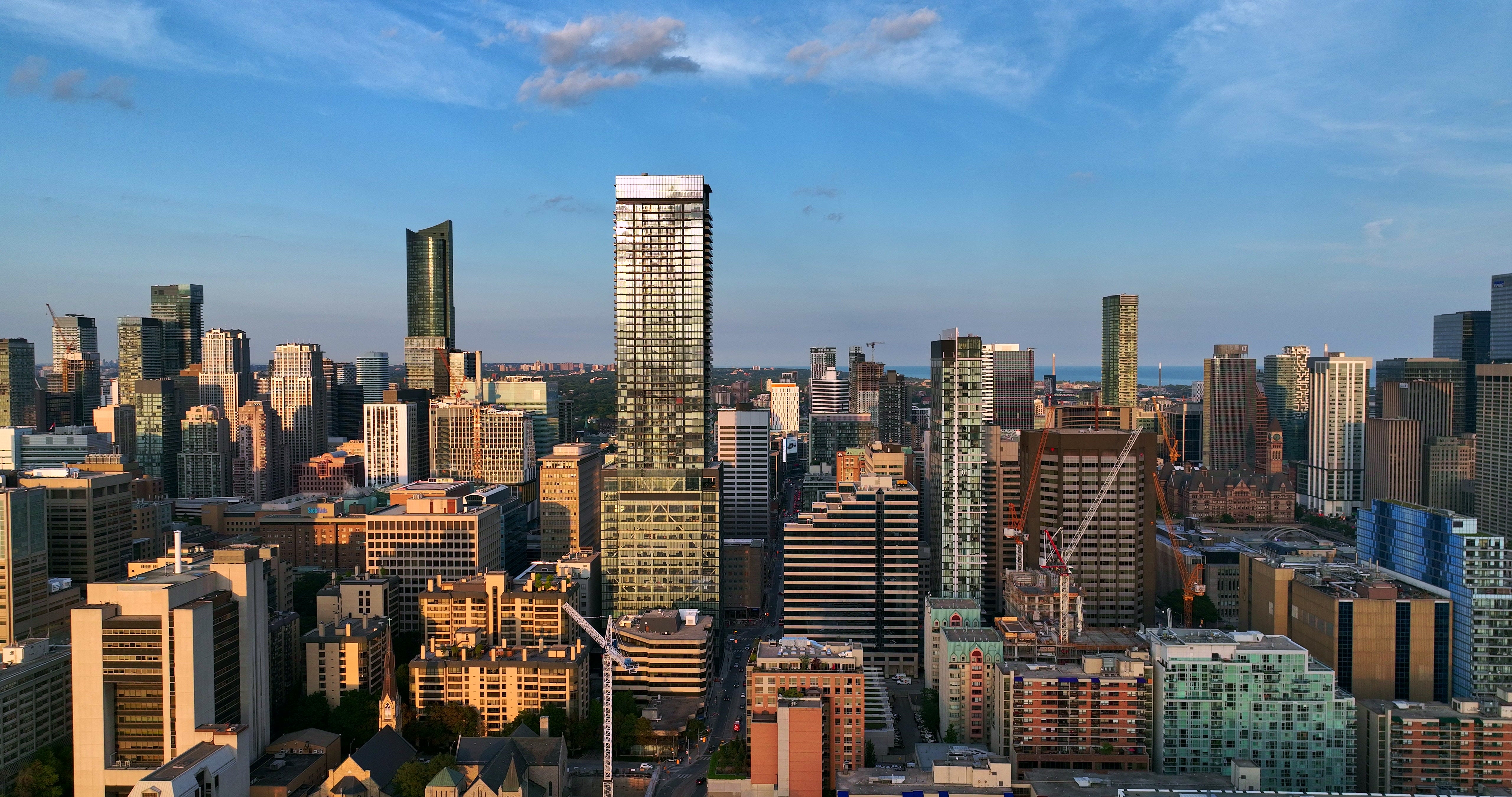 Modern City Skyline at Golden Hour - Aerial in Toronto — 4K stock footage