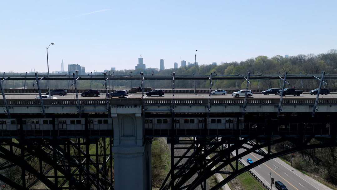Multi - Level Bridge with Traffic and Train - Aerial Tracking — 4K stock footage
