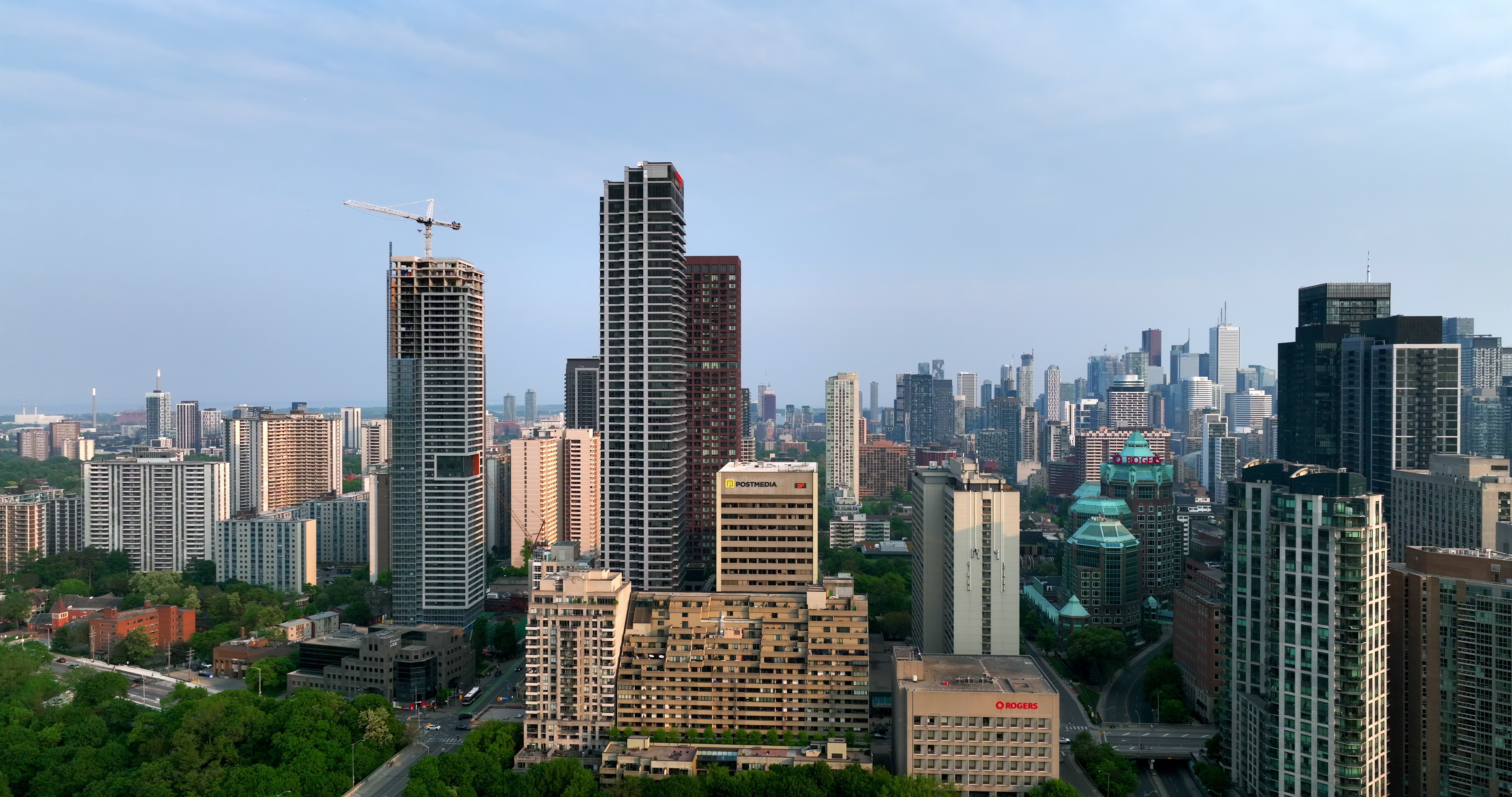 Toronto Skyline with Construction Crane at Sunrise - Aerial — 4K stock footage
