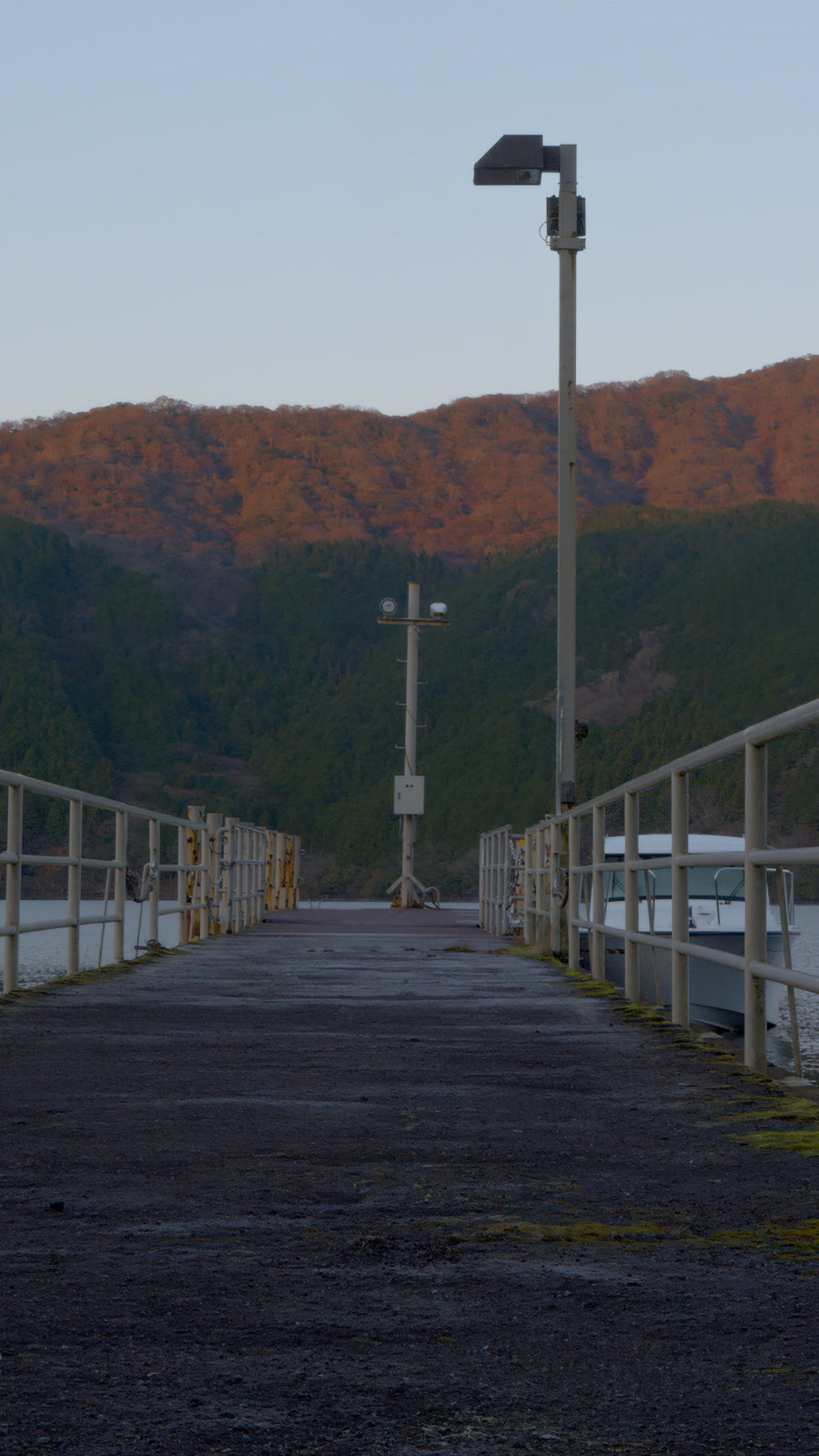 Sunlit Mountain Pier at Golden Hour