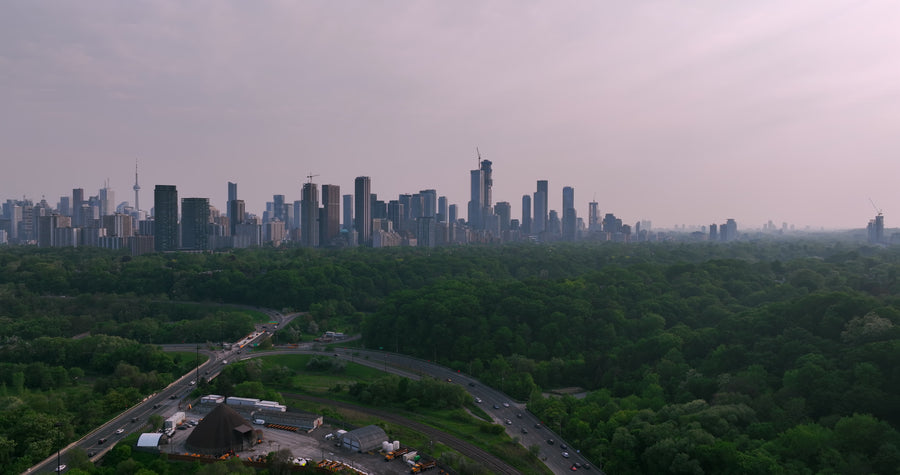 Toronto Skyline at Dusk with Highway and Forest - 5K Aerial