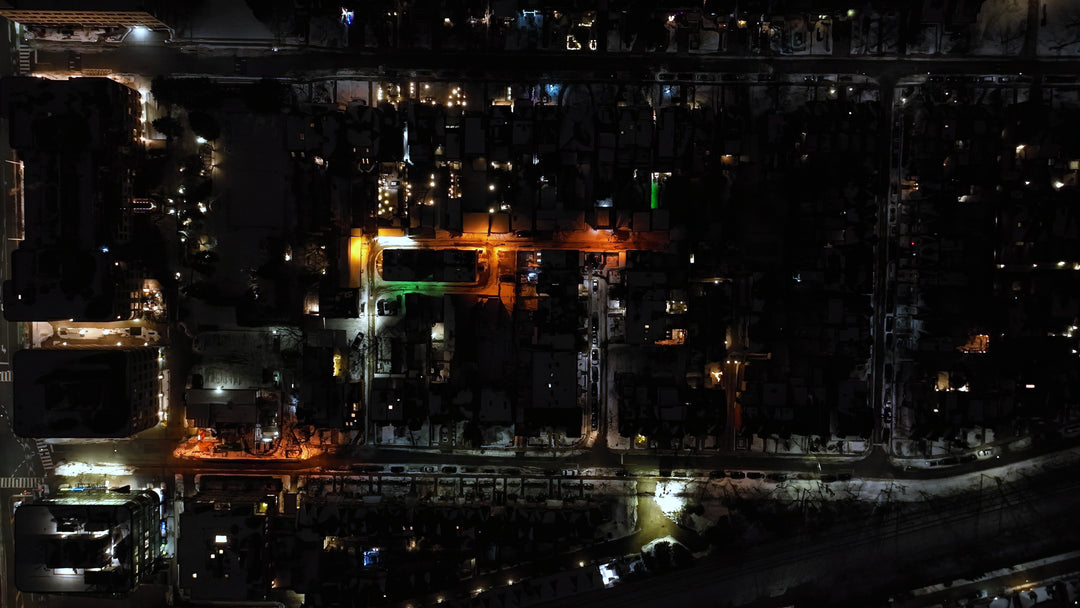 Aerial Top-Down View of Illuminated City Streets at Night — Premium 4K stock footage