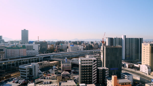 Japanese City with Shinkansen Bullet Train - 5K Aerial