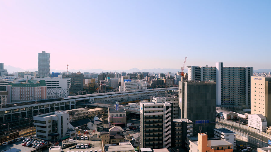 Japanese City with Shinkansen Bullet Train - 5K Aerial