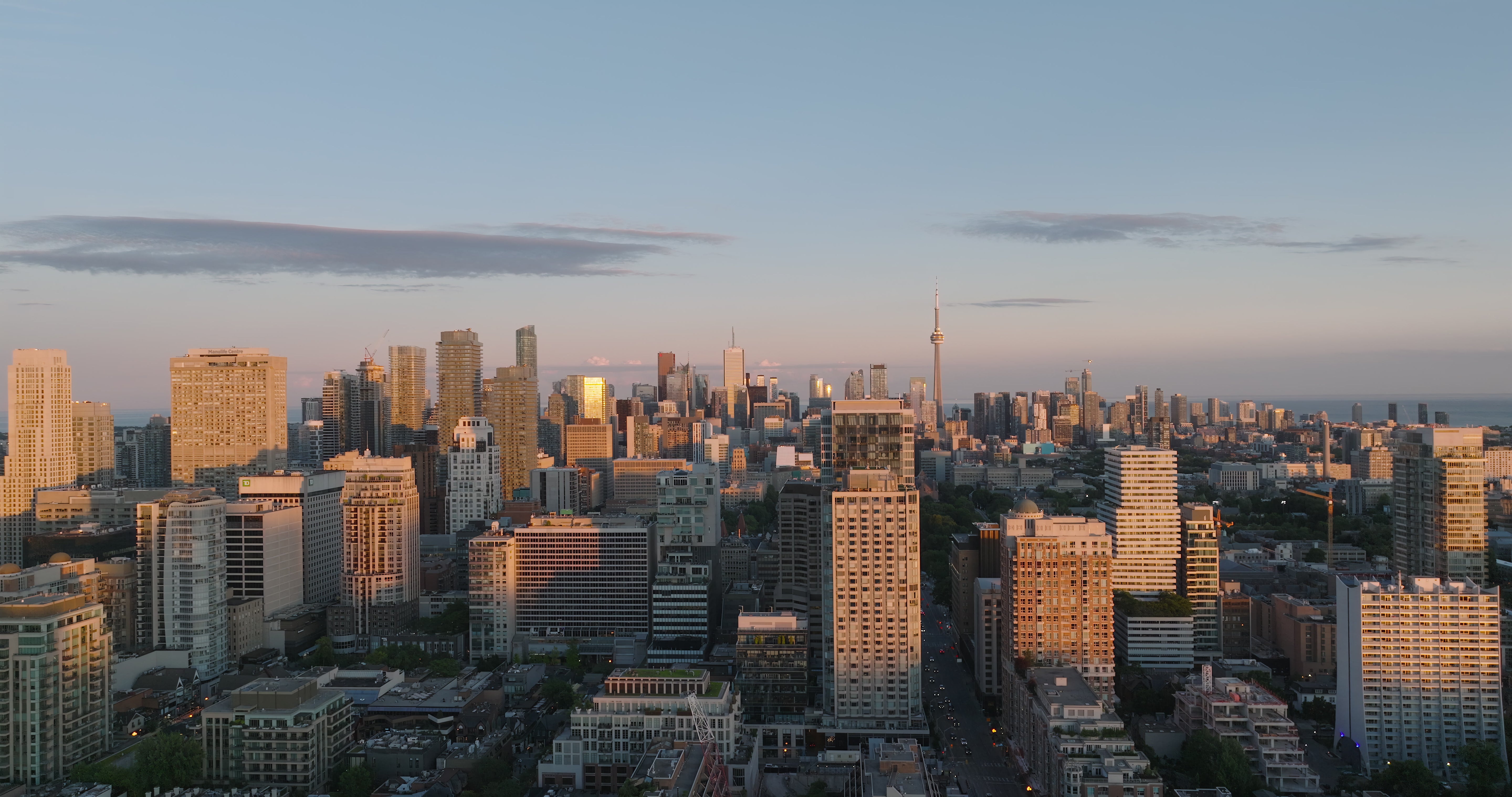 Toronto Skyline Sunset with Warm Golden Light - Aerial at night — 4K stock footage