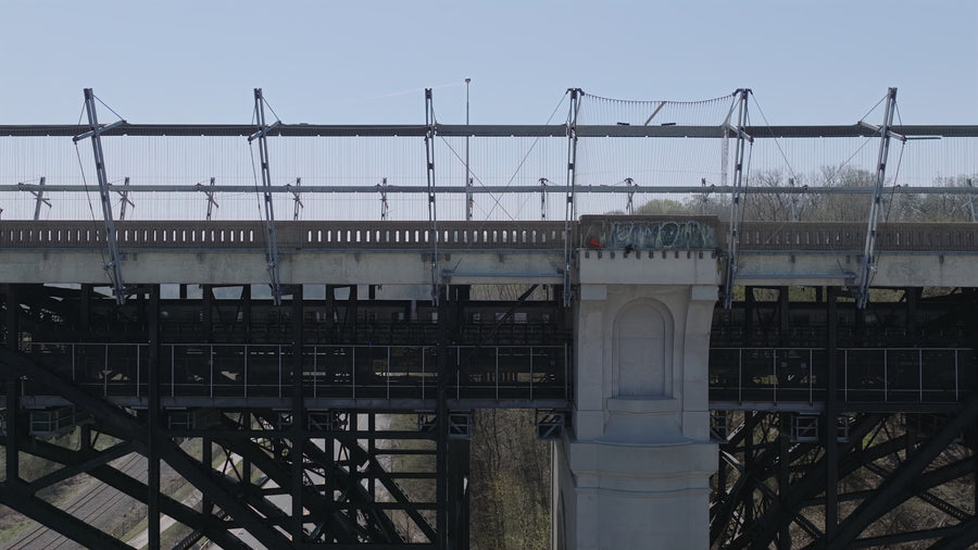 Industrial Railway Bridge with Pedestrian - Aerial Pullback