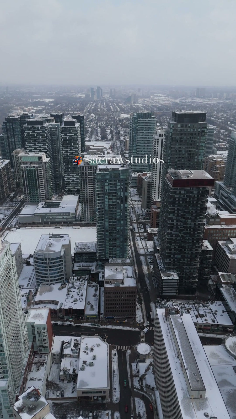 Winter Metropolis Skyline in Snow - Aerial Tracking