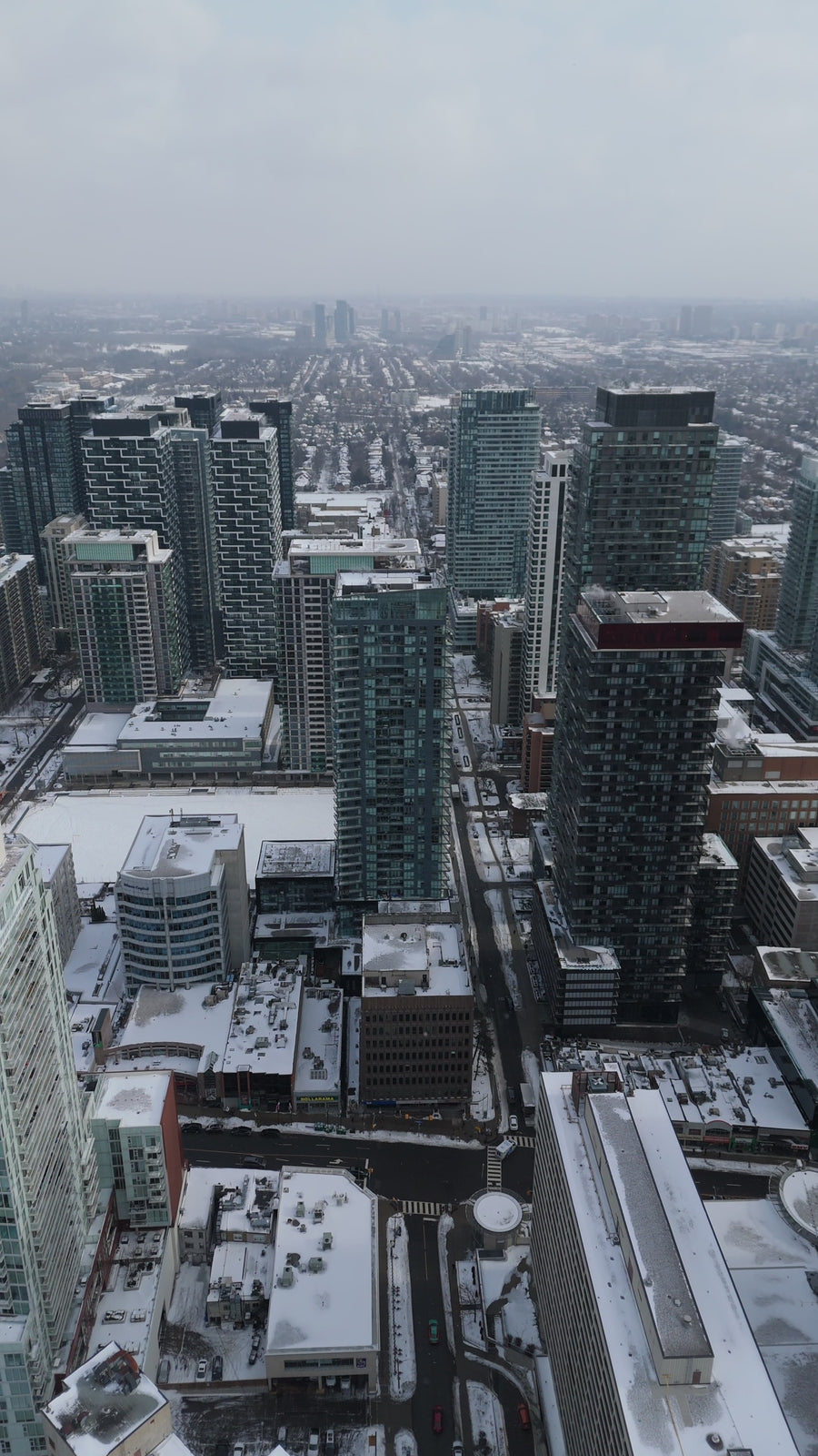 Winter Metropolis Skyline in Snow - Aerial Tracking
